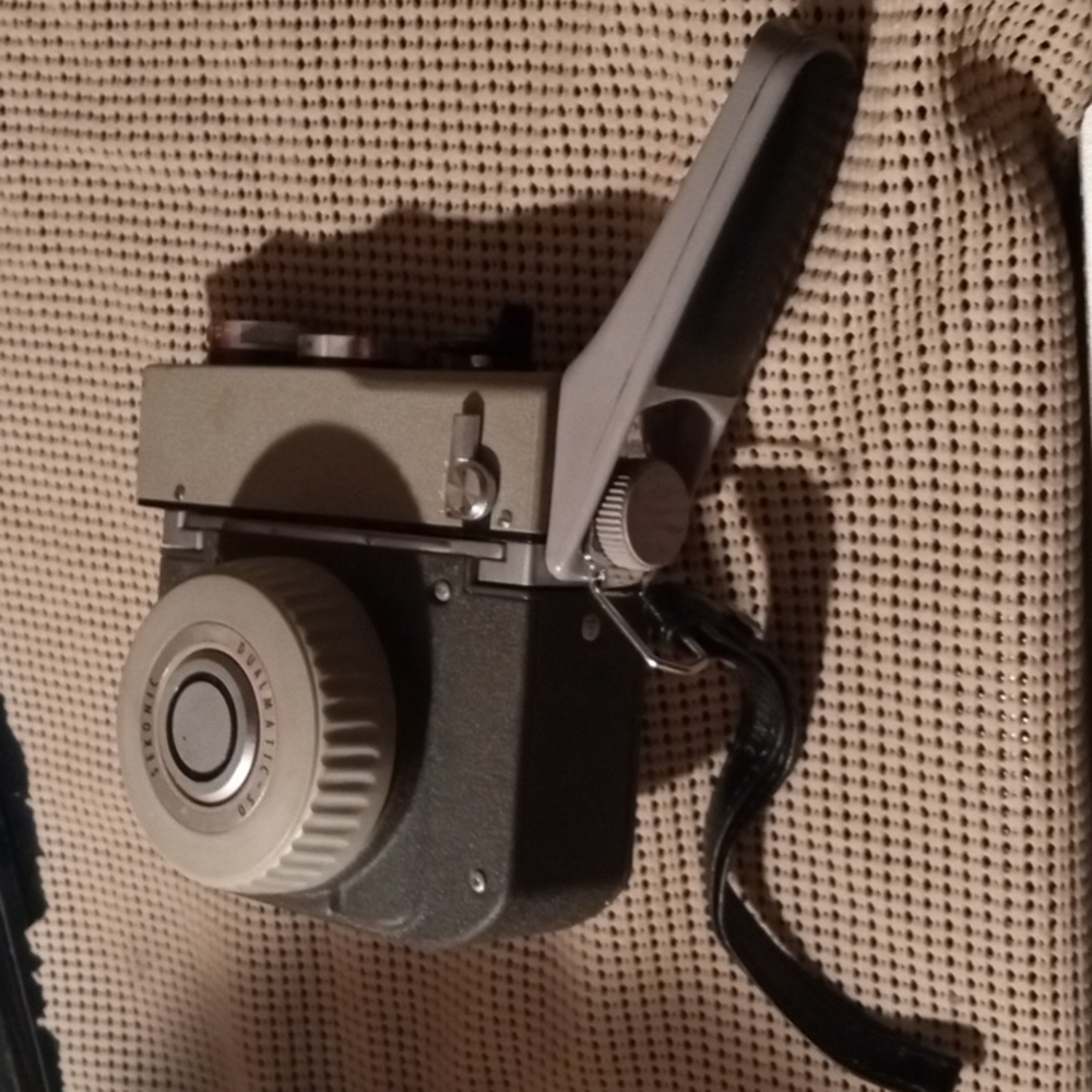 Sekonic Dualmatic -50 Vintage Spool Camera and original leather camera case.